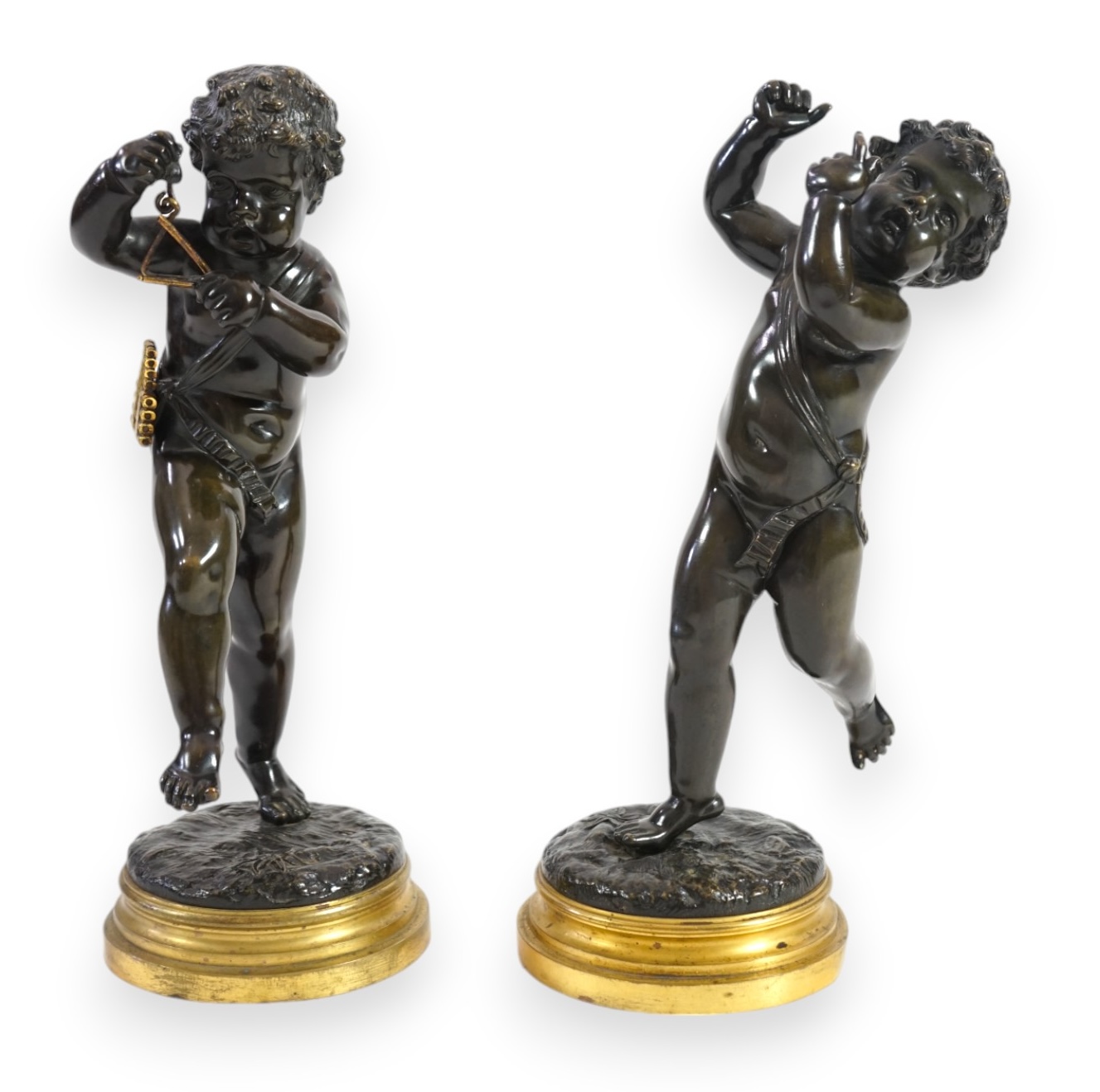 After Claude Michel Clodion (French, 1738-1814), a pair of late 19th century bronze figures of musical putti